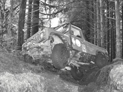 Land Rover Defender 110 across gulley on challenge event